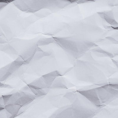 くしゃくしゃになった白い紙の写真