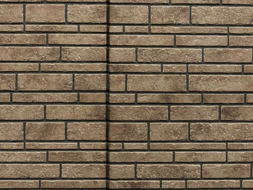レンガ調タイル壁と継ぎ目のテクスチャーの写真
