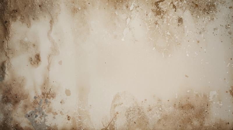 端に濃淡あるシミが広がるアンティーク紙のテクスチャー