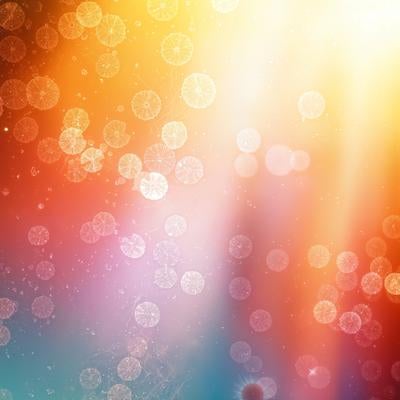 光の粒子や水滴のような丸い模様が映り替わる様子の写真