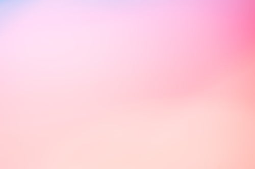 ピンク色のボケた光の写真