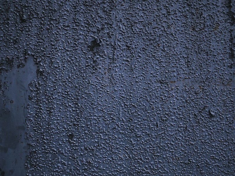 表面に細かいブツブツの残る壁（テクスチャ）の写真