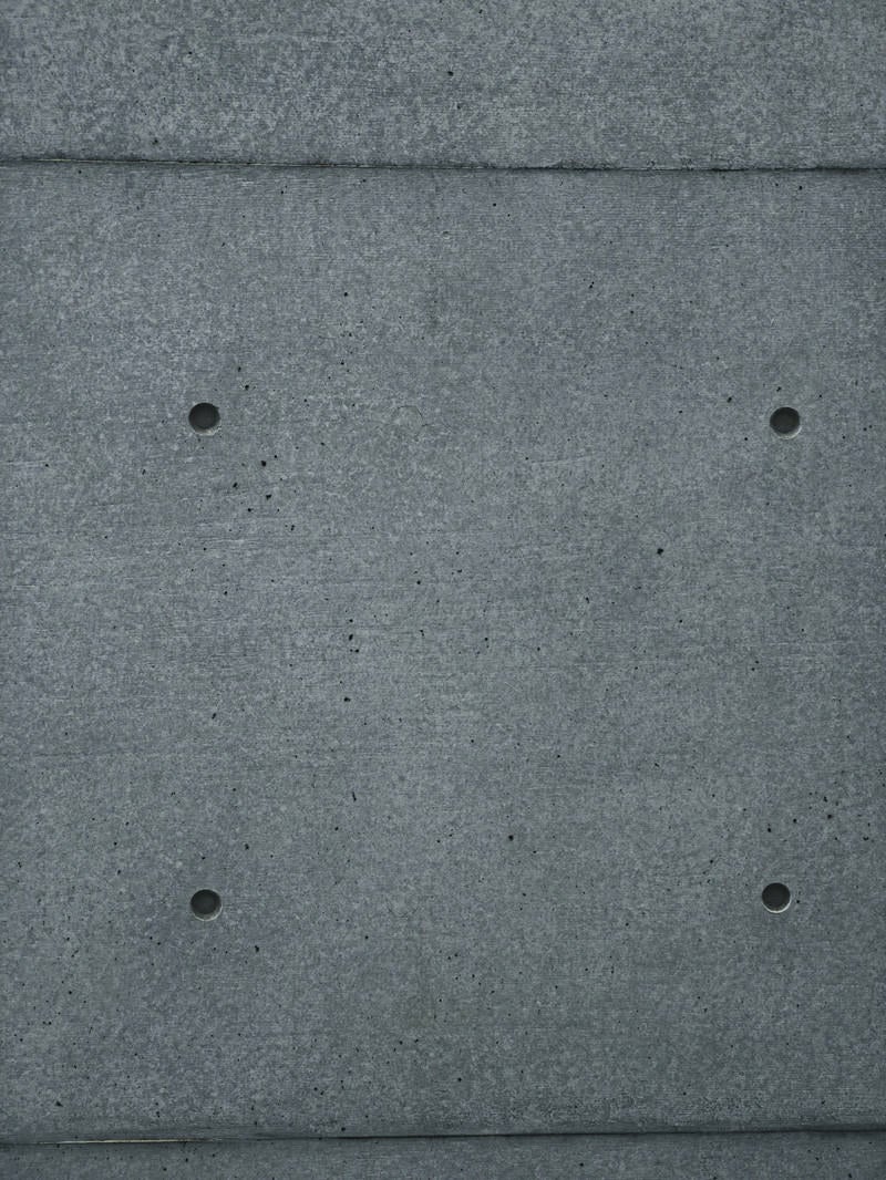「埋めたセパ穴とコンクリート壁（テクスチャ）」の写真
