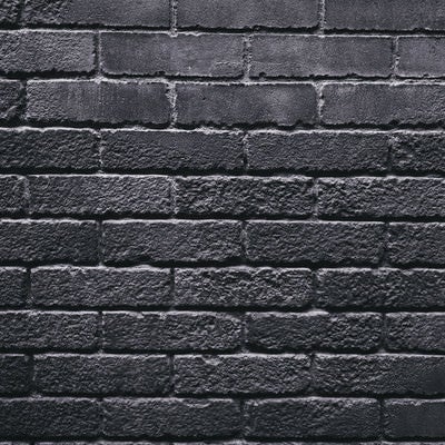 灰色一色のレンガ壁（テクスチャ）の写真