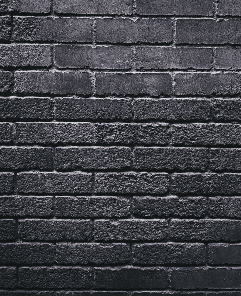 「灰色一色のレンガ壁（テクスチャ）」の写真