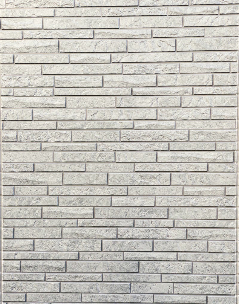 「レンガ調の石材タイルの外壁（テクスチャー）」の写真
