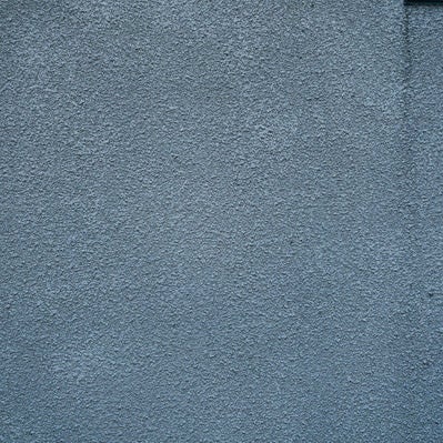 雨ダレのモルタル壁（テクスチャ）の写真