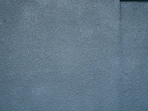 雨ダレのモルタル壁（テクスチャ）の写真