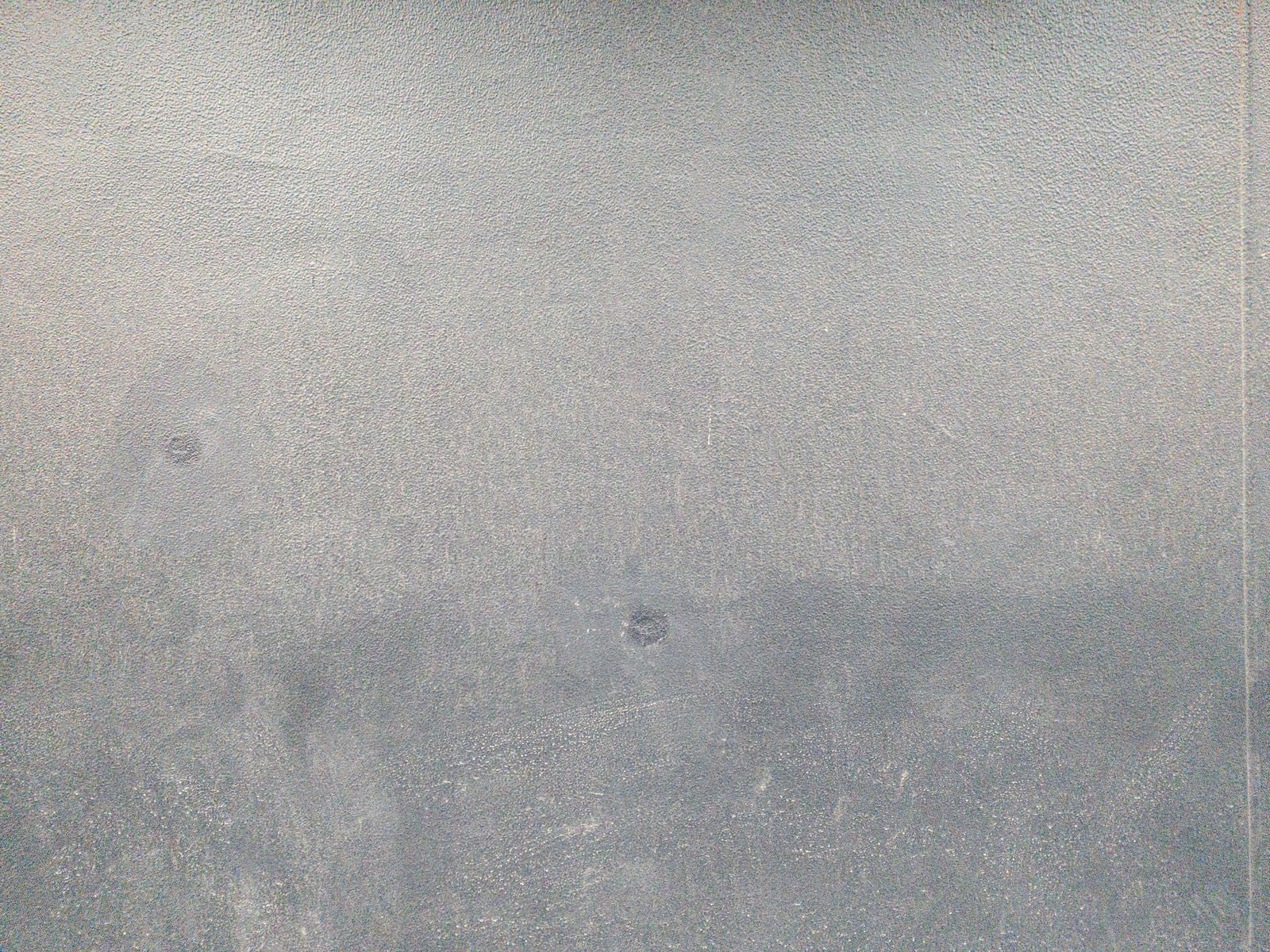 「拭きムラ残るモルタル壁（テクスチャ）」の写真