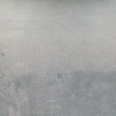 拭きムラ残るモルタル壁（テクスチャ）の写真