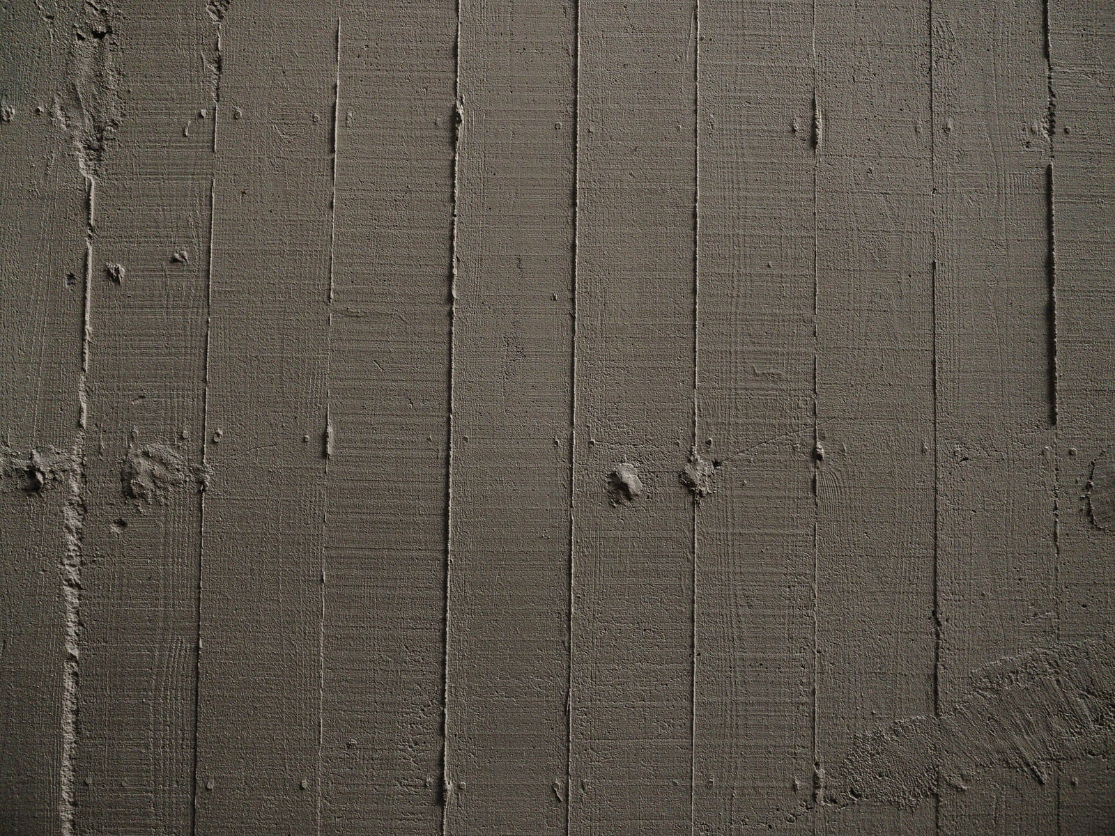 「木目の枠板跡が残る壁（テクスチャ）」の写真