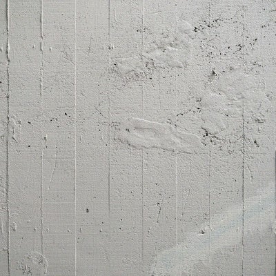 コンクリート壁の補修跡と枠板跡（テクスチャ）の写真