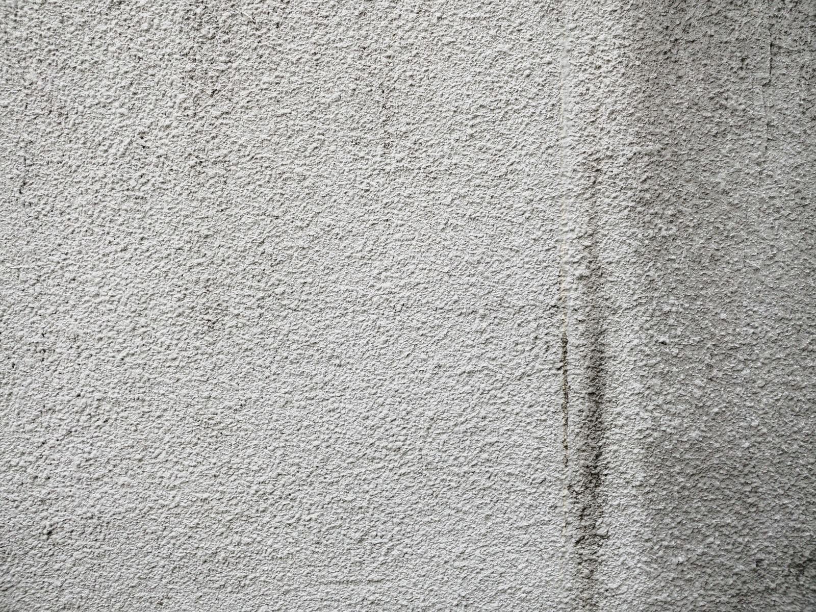 「薄汚れたモルタル壁（テクスチャ）」の写真