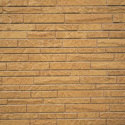 茶色いレンガ風の壁の写真