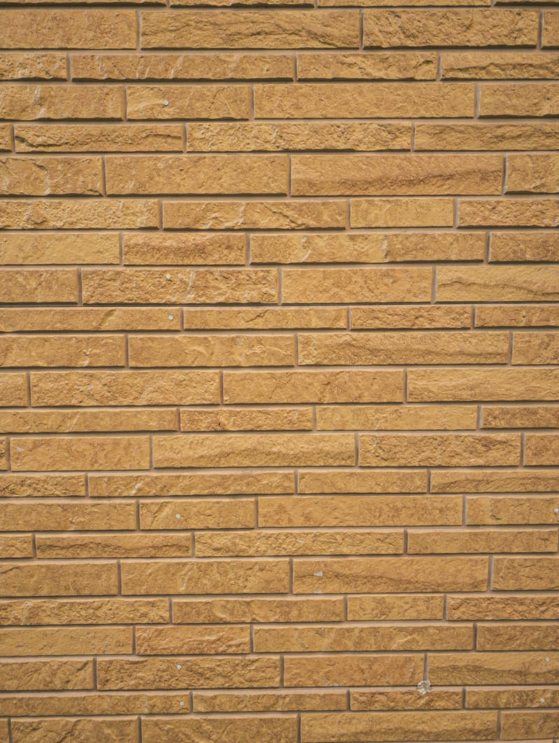 「茶色いレンガ風の壁」の写真