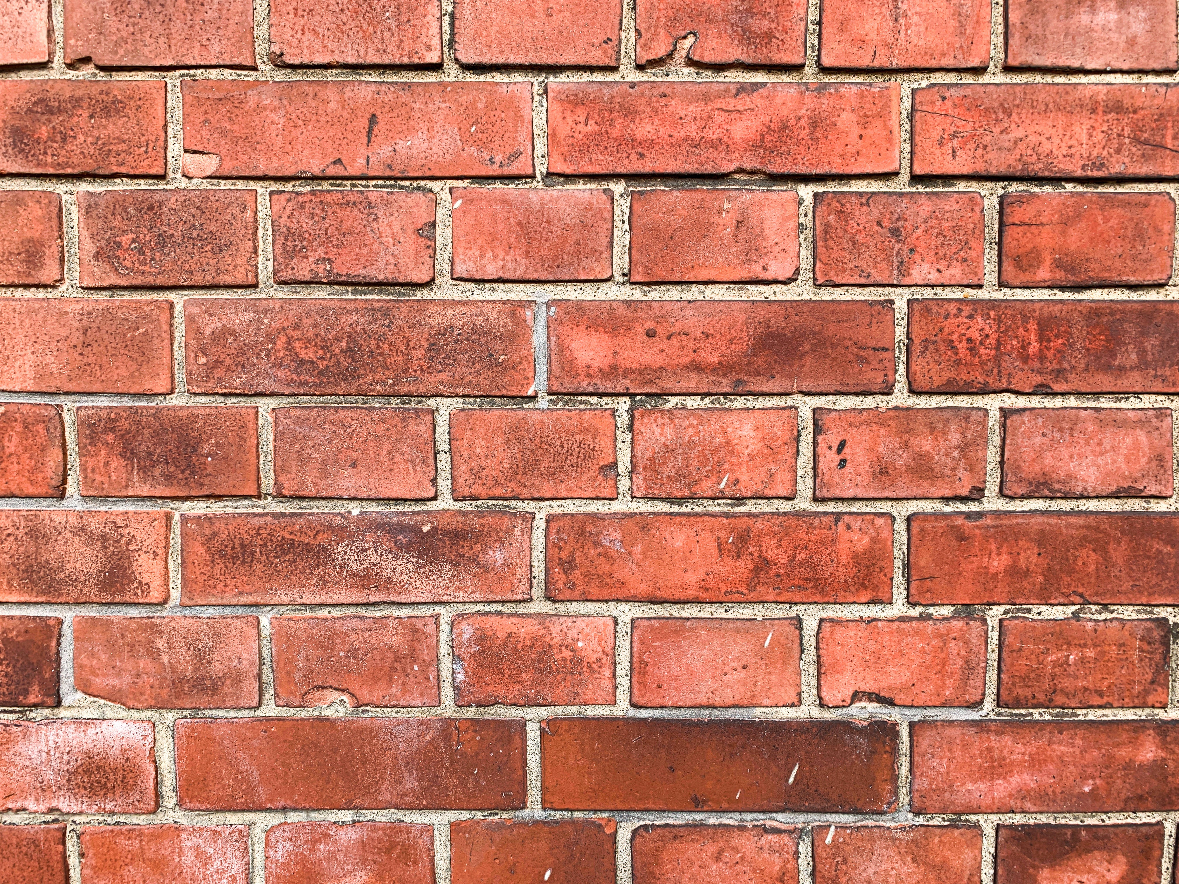 汚れが染み付いた赤レンガ（テクスチャー）の無料の写真素材 - ID