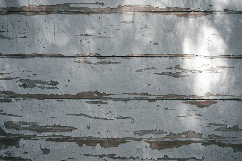 塗装の剝がれた木目の壁（テクスチャー）の写真