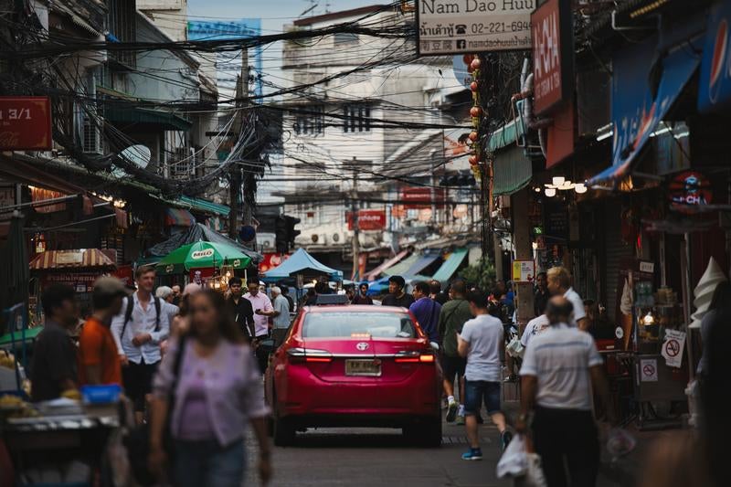 Crowded Back Alleys of Southeast Asia with Taxis