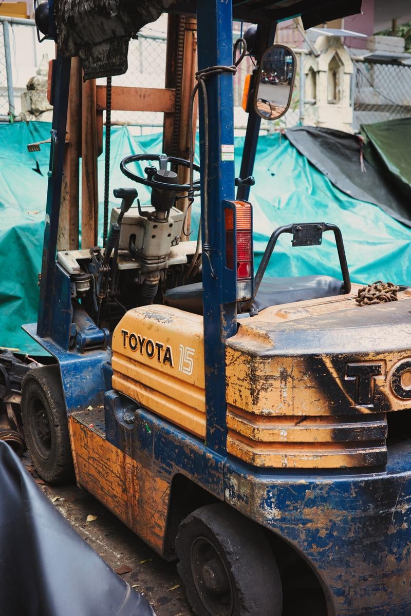 Heavily Used Heavy Equipment on a Work Site - free stock photo