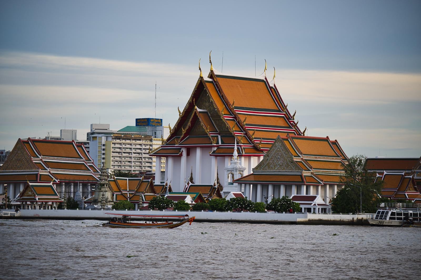 Thai Buddhist Temples along the Chao Phraya River and Sightseeing Boats - free stock photo